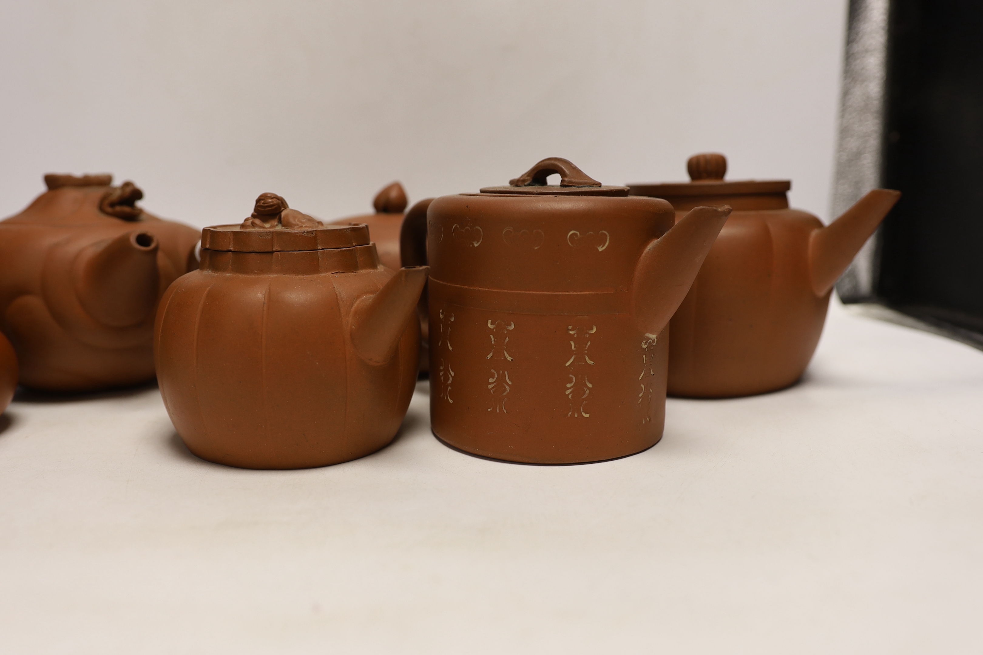 Six Chinese Yixing terracotta teapots, largest 11cm